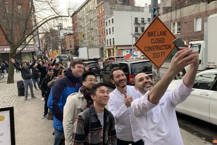 Dominique Ansel takes a selfie with Cedric Grolet and everyone waiting on line<br>